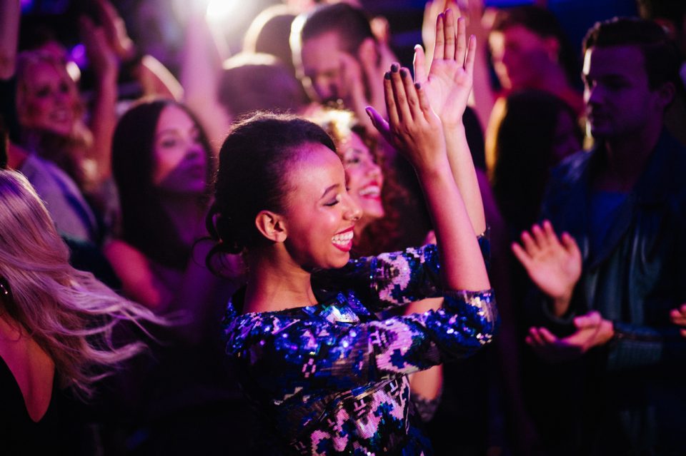 woman enjoys dancing with friends at Summer Jam