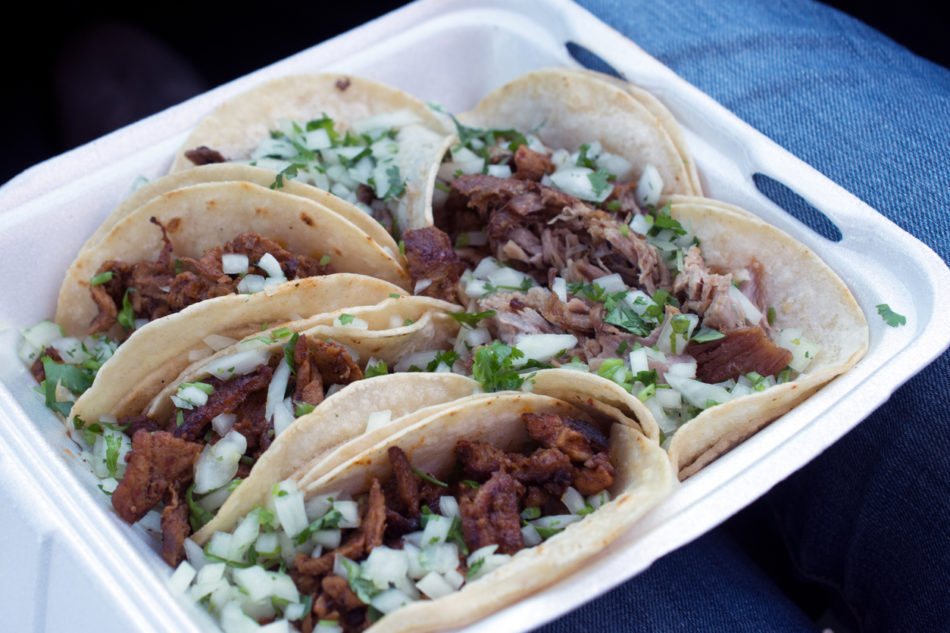 six takeout pork tacos with cilantro