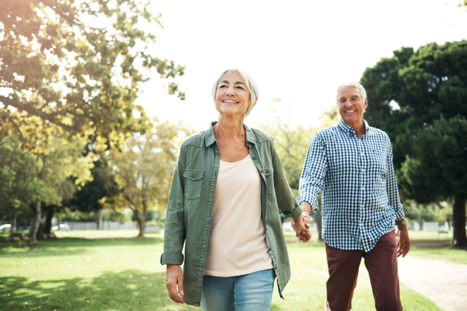 Shot of a happy senior couple going for a walk in the park