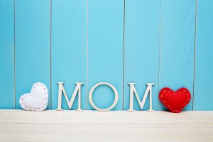 MOM text letters with white and red hearts