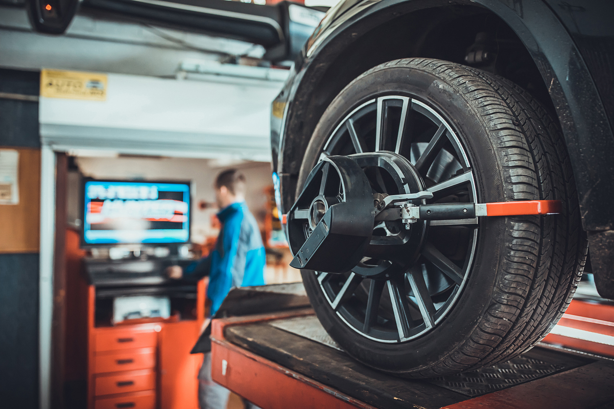 Wheel alignment equipment on a car wheel in a repair station