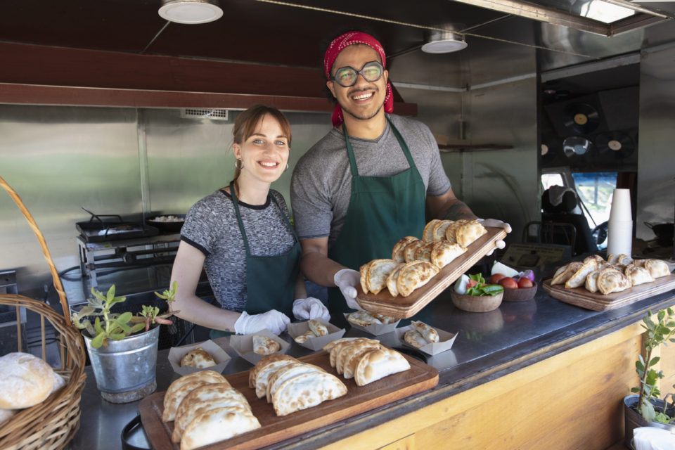 people working inside food truck