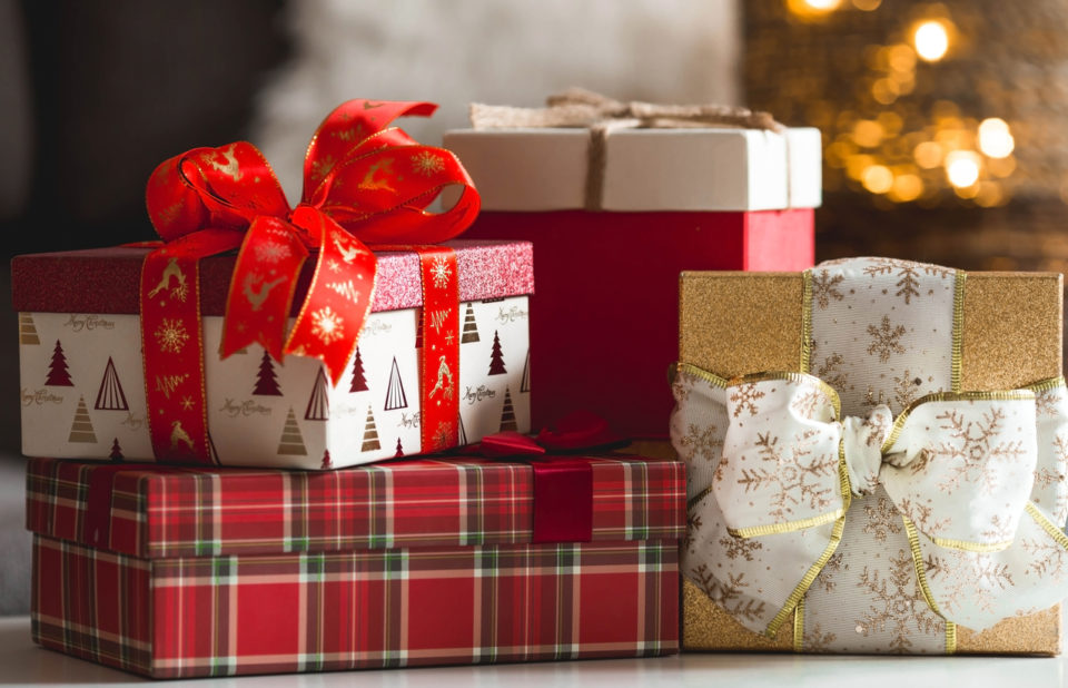 Four cheerfully wrapped Christmas gifts